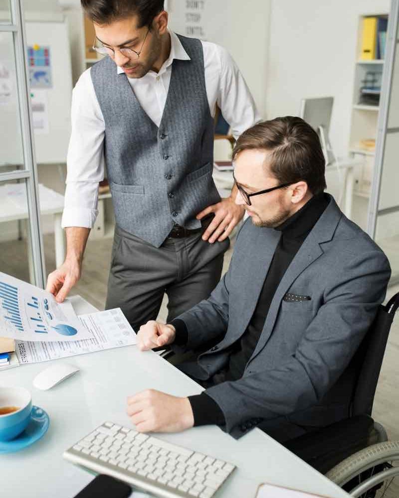 business-people-examining-business-graphs-EYB89TR.jpg